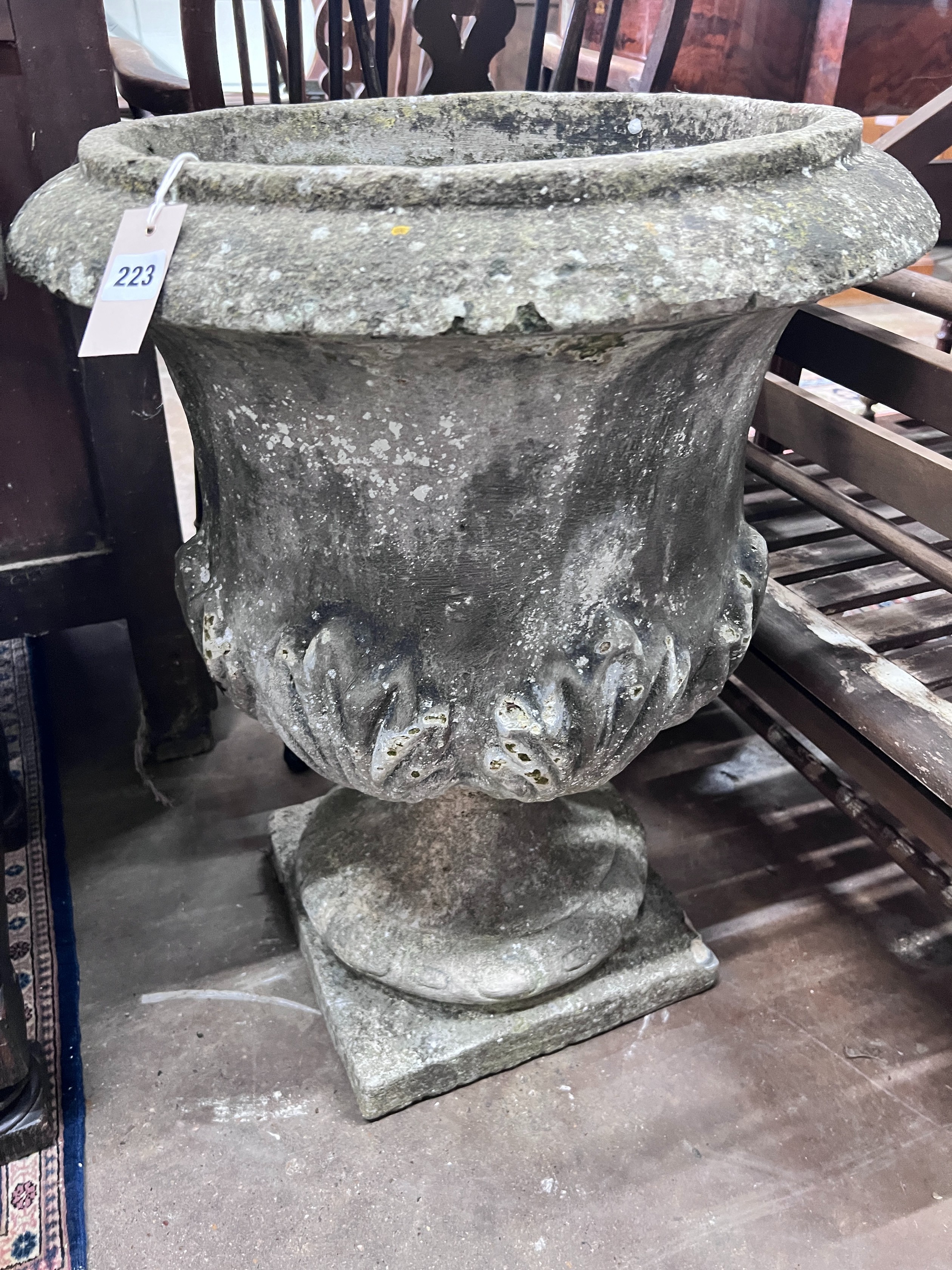 A reconstituted stone garden urn, height 70cm *Please note the sale commences at 9am.